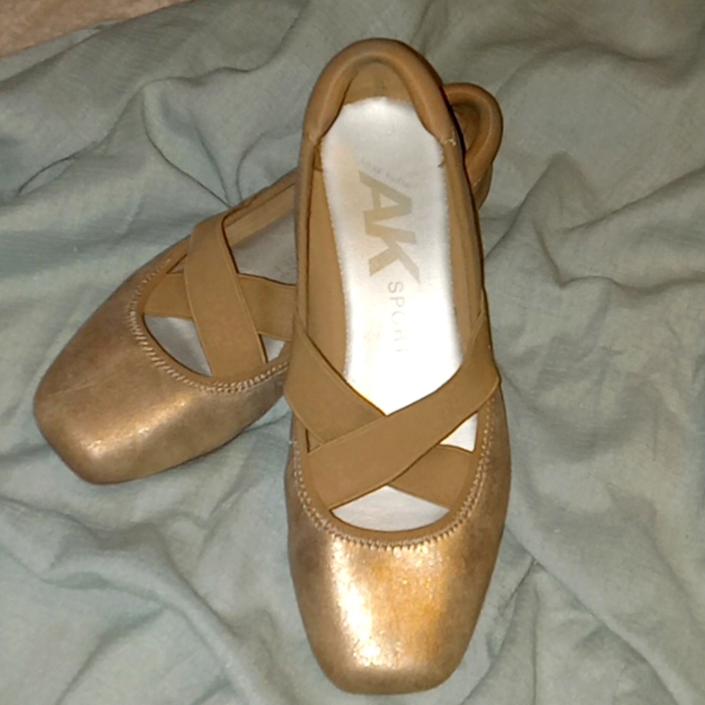 AK gold criss-cross stretchable ballet flats. SIZE 6 1/2 M.